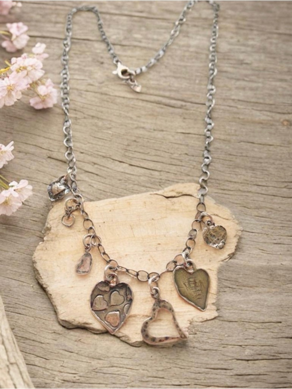 Silpada Seven Heart Charm Necklace N2052
18” to 20” inches.